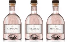 three bottles of mirabau rose wine are shown in this undrecognized image