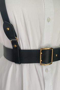 Made of genuine full grain leather, with beautiful black edges and black back.  Gold-colored hardware with a double prong bucket and collar pin. This beautifully made harness allowed for the easiest wardrobe update. 
Wear this classic black belt with or without the harness to define your look. Layer with the harness over dresses, tops, sweaters and suits for an edgy and modern look. Made for "The True Size Majority" sizes 10-22 by BAACAL Cynthia Vincent. Collar Pin, Leather Halter, Collar Pins, Wardrobe Update, Black Back, 10 22, Back To Black, Black Belt, Leather Working