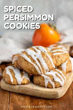 the recipe for spiced persimmon cookies is shown on a cutting board with oranges in the background