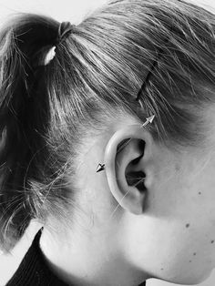 a woman with ear piercings on her ears