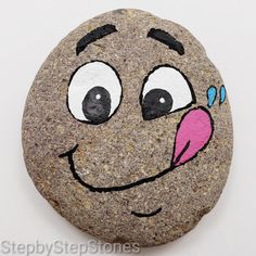 a rock with a face painted on it