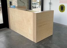 a wooden counter sitting inside of a building