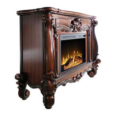 an ornate wooden fireplace with a fire in it