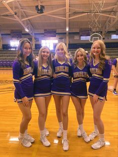 the cheerleaders are posing for a photo