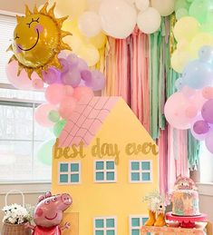 a birthday party with balloons, decorations and peppa the pig cake on a table