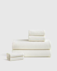 three white towels stacked on top of each other