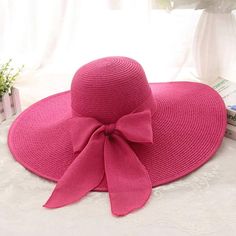 Straw Wide Brim Beach Hat With Bow * Hot Pink * Wide Brim * Foldable * Bow * 100% Polyester * One-Size * Crown: 58cm/22.8" * Hat Comes Folded Pink Vacation Hat With Curved Brim, Pink Vacation Hats With Curved Brim, Pink Summer Hat For Beach Season, Pink Curved Brim Vacation Hat, Pink Curved Brim Hat For Vacation, Chic Pink Summer Hat, Adjustable Pink Sun Hat For Vacation, Pink Summer Sun Hat For Vacation, Summer Pink Sun Hat For Vacation