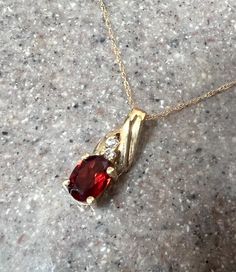 10K Yellow Gold Garnet & CZ Pendant Necklace  Weight:  1.2 grams  Gem Stone:  Garnet and CZ  Composition:  10K Gold, stamped on both pieces  Condition:  Good Era:  Vintage Measure:  3/16" (w) 5/8" (h)  Chain: 18" long Will ship in a gift box  Stock # N1159 As with all jewelers, I do enlarge pictures of the jewelry.  This is to your advantage, so you can see all details more clearly.  I do provide measurements of the jewelry, so be sure to read the description to better understand the true size o Cz Pendant, Gem Stone, Tape Measure, 10k Gold, Ruler, Garnet, Necklace Etsy, Jewelry Necklace Pendant, To Read