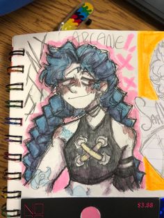 a drawing of a girl with blue hair and piercings on her face next to a notepad