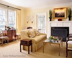 a living room filled with furniture and a fire place