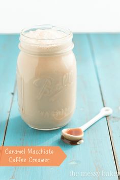 a glass jar filled with caramel macchato coffee creamer next to a spoon