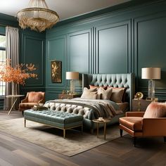 a bedroom with green walls and furniture in the corner, along with a chandelier