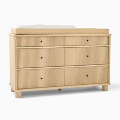 the chest of drawers is made out of wood