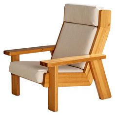 a chair that is made out of wood and has a cushion on the armrest