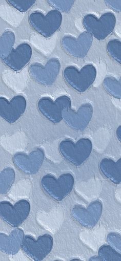 blue hearts are arranged in the shape of heart shapes on a light blue and white background