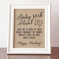 a framed sign with the words baby soak hunt 35 in black lettering on it