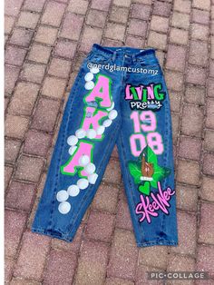 BUYER MUST PROVIDE THEIR OWN JEANS All artwork is hand painted and can be customized to your liking with any fraternity or sorority. Message me if you have any questions.  Once payment is received, you will receive shipping address. Please allow up to 6 weeks (this does not include the time it takes to be ship to you) for completion, starting from the date your jeans have been marked delivered to me. If you need it sooner, please message us to confirm availability. Spirit Overalls Homecoming, Homecoming Pants Decorated, Spirt Jeans, Homecoming Jeans Decorated, Spirit Jeans Ideas, Aka Jeans, Decorating Jeans, Homecoming Overalls, Homecoming Jeans