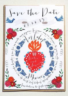 a wedding card with the words save the date on it and an image of a heart surrounded by flowers