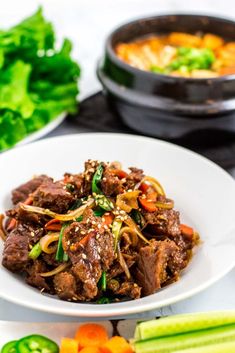 beef and vegetable stir fry on a white plate