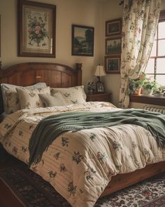 a bed sitting in a bedroom next to a window covered in curtains and blankets on top of a rug