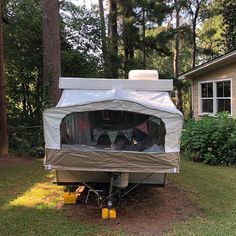 an rv parked in front of a house