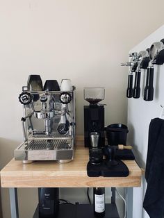 a coffee machine sitting on top of a wooden table