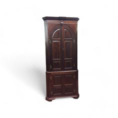 a tall wooden cabinet with two doors on the front and one door open to reveal an arched doorway