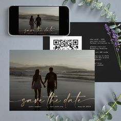 save the date cards with an image of two people holding hands and walking along the beach