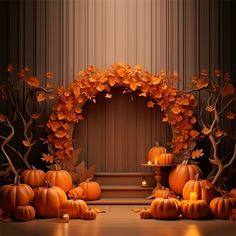 pumpkins and candles are arranged in front of an arch