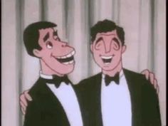 two men in tuxedos standing next to each other with their arms around one another