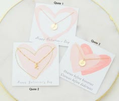 three valentine's day cards with gold heart pendants