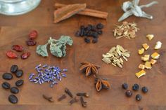 several different types of spices on a wooden table