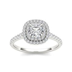 a cushion cut diamond ring with double halos