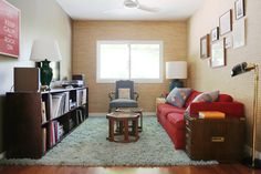 the living room is clean and ready to be used as a den or home office