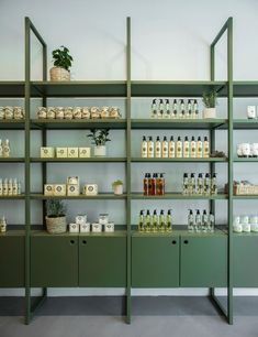 the shelves are filled with many different types of bottles and containers, all lined up against each other