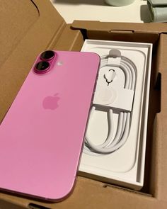 an apple phone in its box with the new charger plugged into it's charging cable