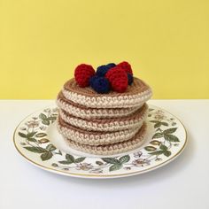 a stack of crocheted pancakes sitting on top of a plate