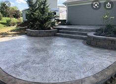 a concrete patio with steps leading up to it