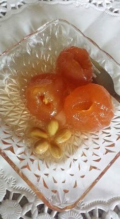 there is a glass plate with some fruit on it