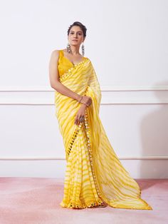 Color_Yellow Leheriya Saree Blouse Designs, Yellow Saree Look For Haldi, Yellow Saree With Mirror Work For Festivals, Elegant Yellow Saree With Mirror Work, Yellow Tissue Saree, Yellow Saree For Haldi, Yellow Mirror Work Pre-draped Saree For Festivals, Yellow Georgette Pre-draped Saree With Mirror Work, Yellow Leheriya Saree