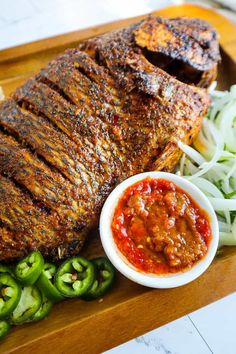 grilled meat and vegetables on a cutting board