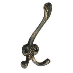 an old metal hook with ornate designs on it's end, against a white background