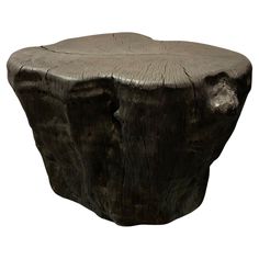 a wooden table that has been carved into the shape of a tree stump