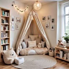 a child's bedroom with a teepee tent and teddy bears