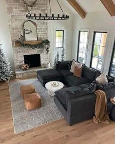 a living room filled with furniture and a fire place in the middle of a room