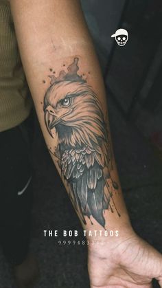 an eagle tattoo on the arm