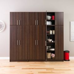 a room with some cabinets and a clock on the wall