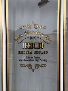 the sign on the glass door says san francisco and jericho design studio interior design store decoration shop painting