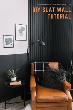 a brown leather chair sitting in front of a black wall with a white rug on top of it