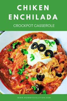 chicken enchilada in a white bowl with black olives and sour cream